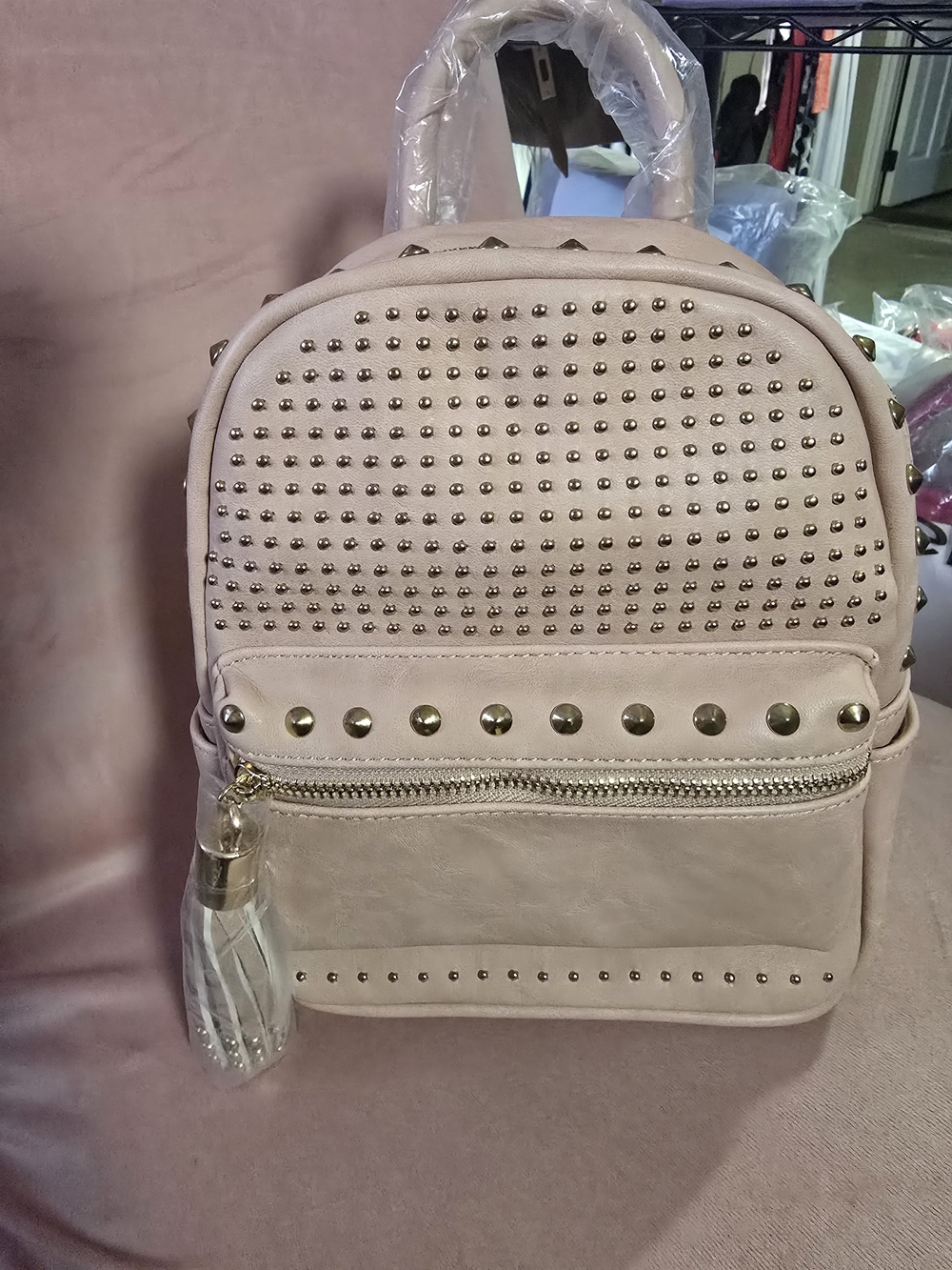 Brentano Studded Mini Backpack in Light Pink And Tassel Bag Charm